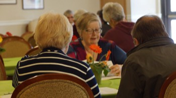  Guests Discussing Life at V V C With Staff/Resdidents 